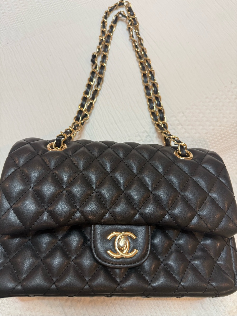 Black quilted lamb skin with gold hardware